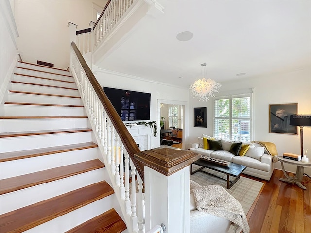 living room with wood-type flooring and a chandelier