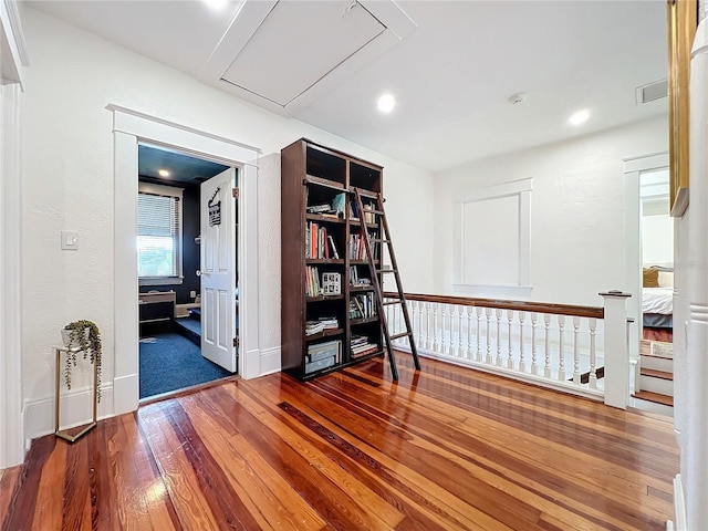 corridor with wood-type flooring