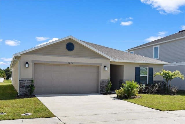 view of front facade with a garage and a front lawn