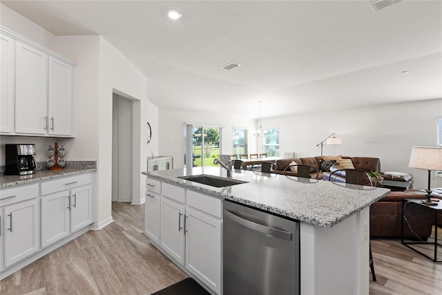 kitchen with sink, dishwasher, a kitchen island with sink, light hardwood / wood-style floors, and white cabinets