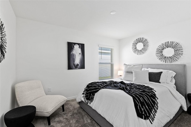 bedroom featuring dark colored carpet