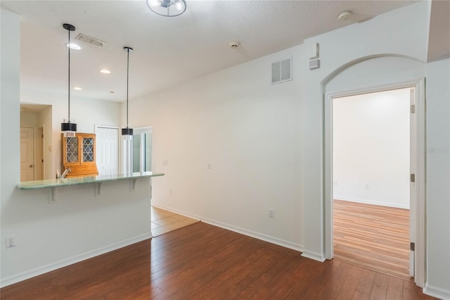 unfurnished living room featuring hardwood / wood-style floors