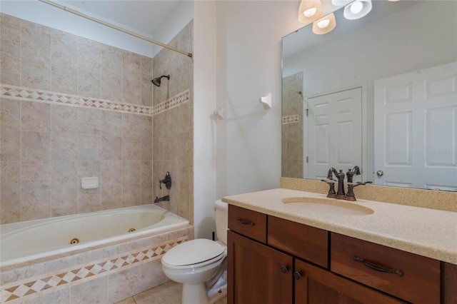 full bathroom featuring tile patterned floors, vanity, toilet, and tiled shower / bath combo