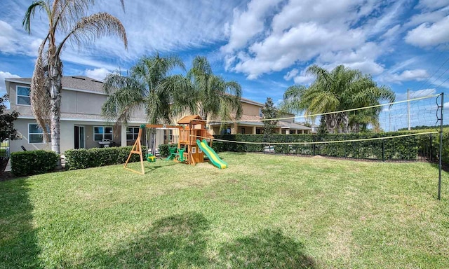 view of jungle gym featuring a lawn