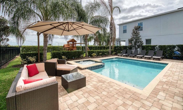 view of pool with a playground, an in ground hot tub, an outdoor hangout area, and a patio area