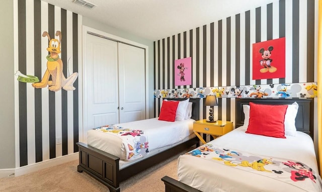 carpeted bedroom featuring a closet