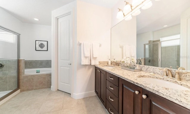 bathroom featuring vanity, independent shower and bath, and tile patterned flooring