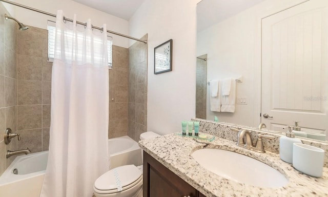 full bathroom featuring vanity, toilet, and shower / tub combo