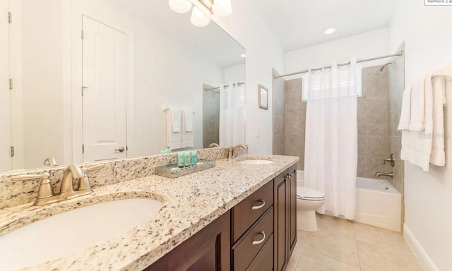 full bathroom featuring toilet, vanity, shower / bathtub combination with curtain, and tile patterned flooring