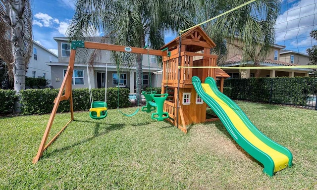 view of playground featuring a lawn