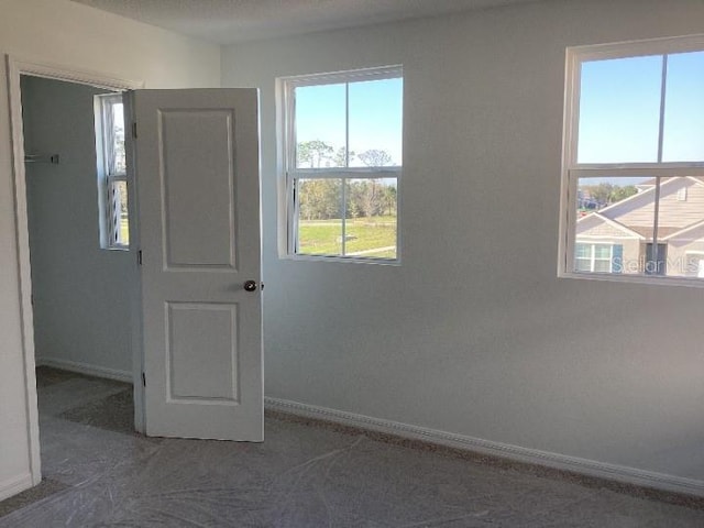 interior space featuring baseboards