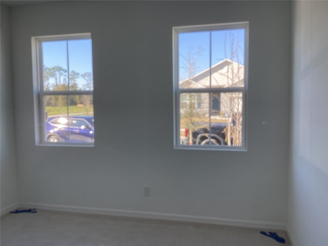 empty room with baseboards