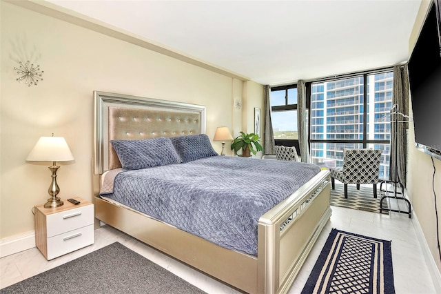 bedroom featuring a wall of windows