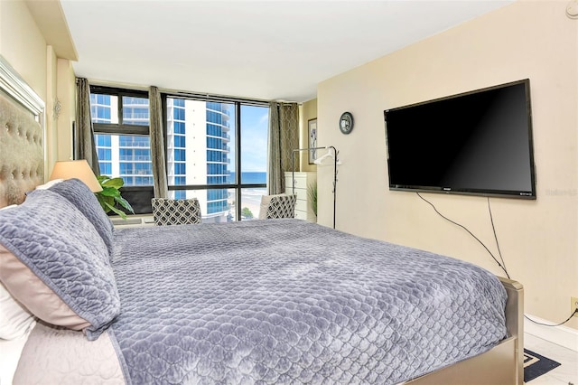 bedroom featuring floor to ceiling windows