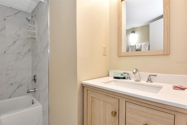 bathroom featuring vanity and tiled shower / bath combo