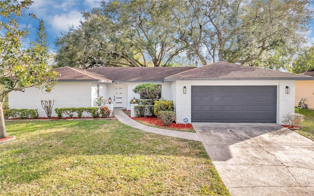 single story home featuring a garage and a front yard