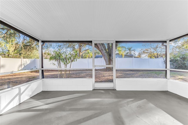 unfurnished sunroom featuring plenty of natural light