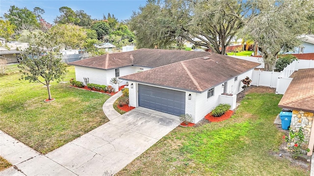 view of front of property with a garage and a front yard