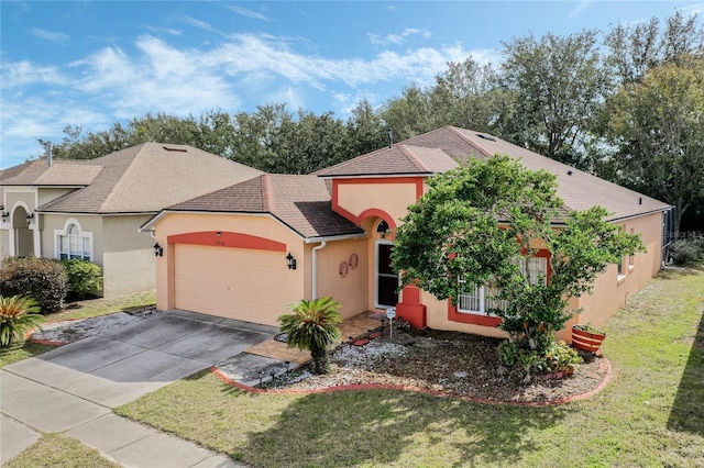 view of front of property featuring a garage and a front yard