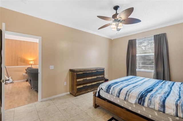 bedroom featuring light tile patterned flooring, ornamental molding, and ceiling fan