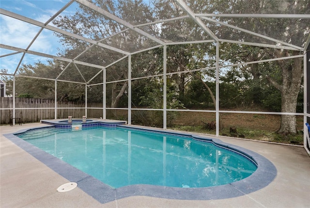 view of pool featuring an in ground hot tub, a lanai, and a patio area