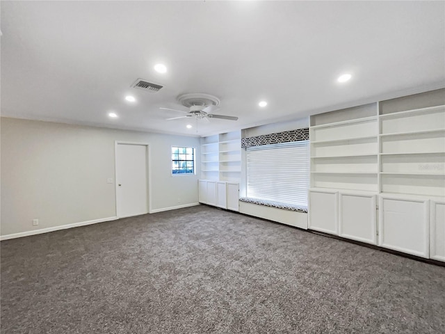 interior space featuring built in shelves and ceiling fan