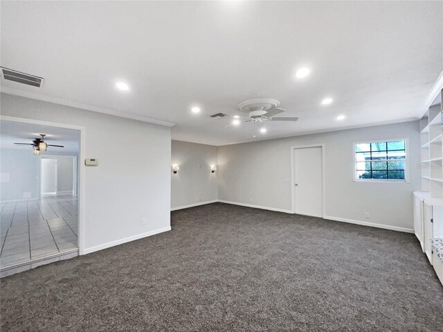 carpeted empty room with crown molding and ceiling fan