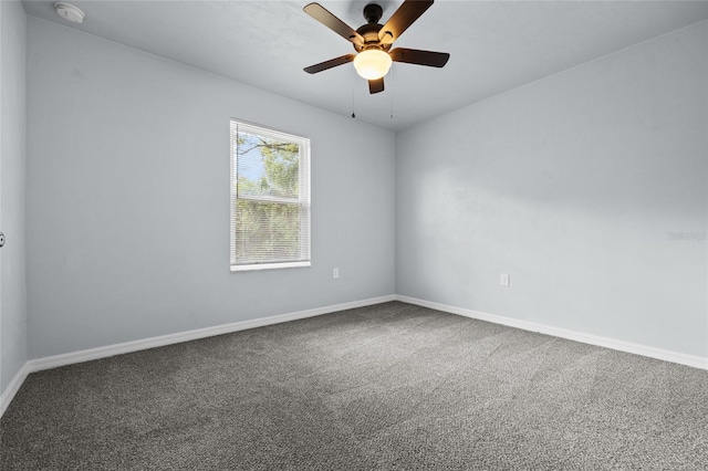 unfurnished room with ceiling fan and carpet flooring