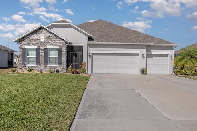 view of front of house featuring a garage and a front yard