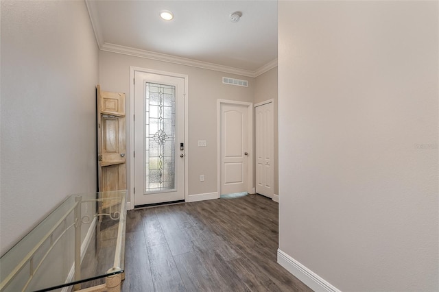 entryway featuring ornamental molding and dark hardwood / wood-style flooring