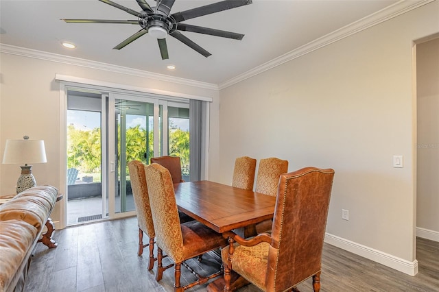 dining area featuring crown molding, dark hardwood / wood-style floors, and ceiling fan