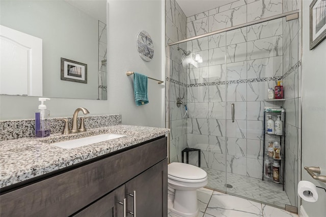 bathroom with vanity, toilet, and walk in shower