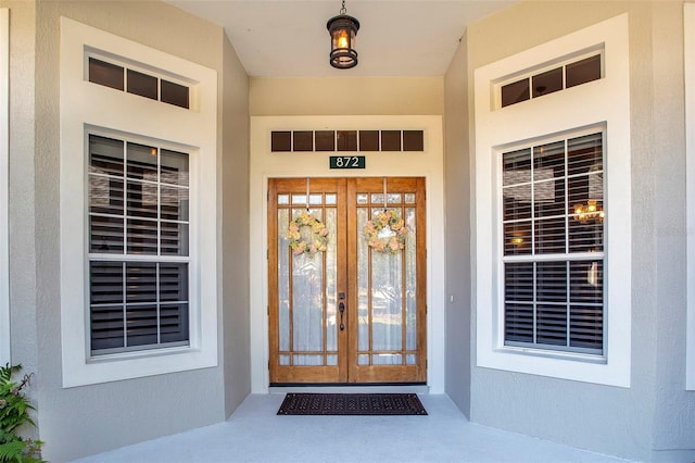 property entrance featuring french doors