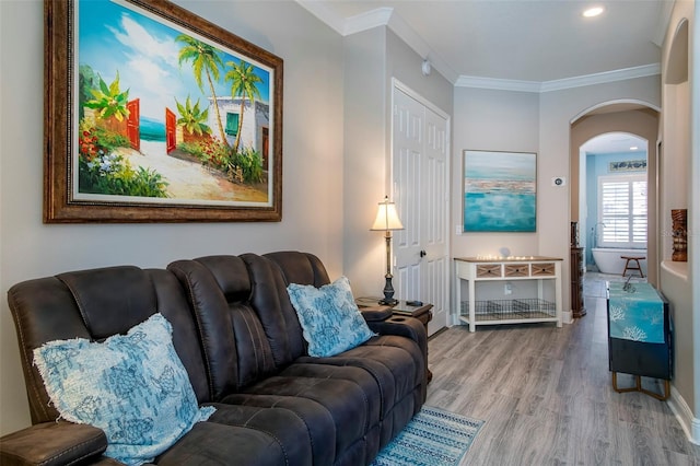 living room featuring ornamental molding and hardwood / wood-style floors