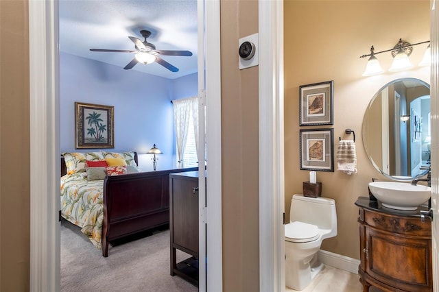 carpeted bedroom featuring sink