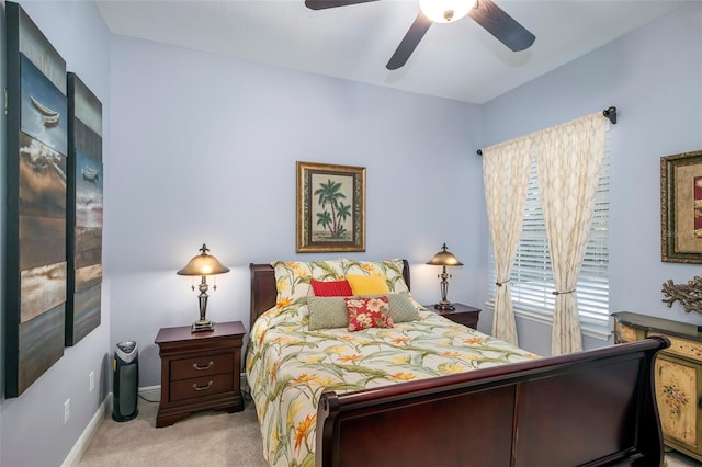 bedroom with light colored carpet and ceiling fan