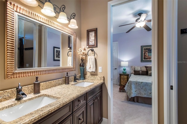 bathroom featuring ceiling fan and vanity