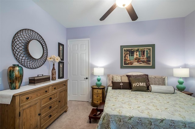 bedroom with ceiling fan and light carpet