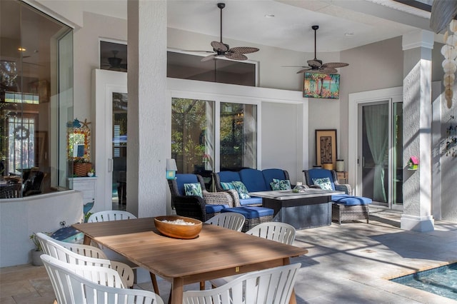 view of patio with outdoor lounge area and ceiling fan