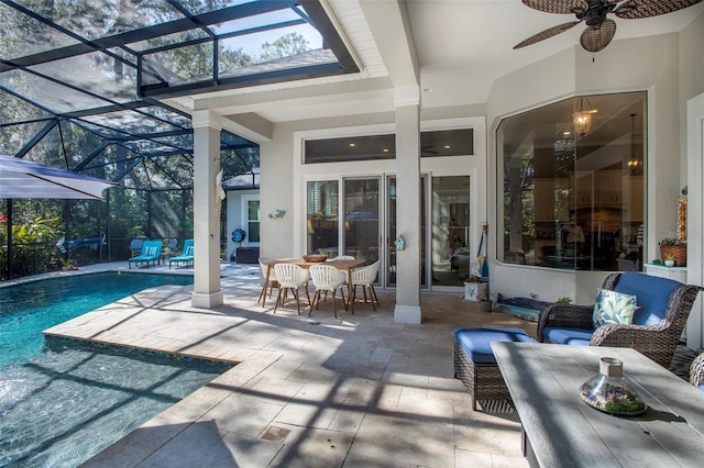 view of patio / terrace with ceiling fan and glass enclosure