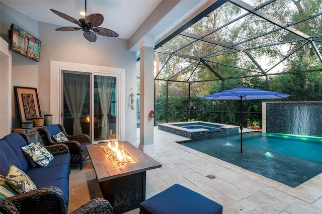 view of pool with an in ground hot tub, pool water feature, glass enclosure, and a patio area