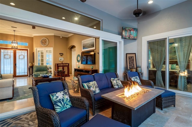 view of patio / terrace featuring an outdoor living space with a fire pit and ceiling fan