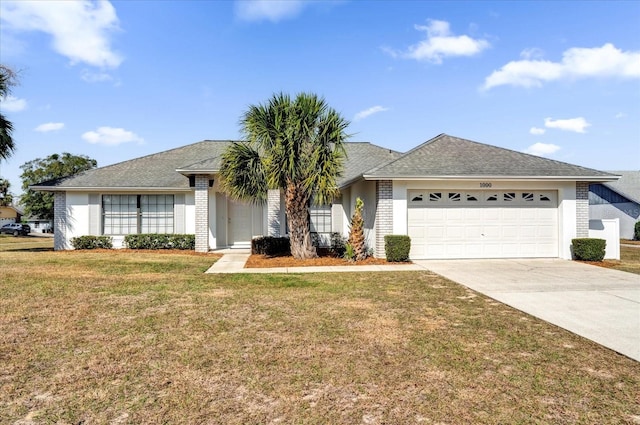 ranch-style house featuring a garage and a front lawn