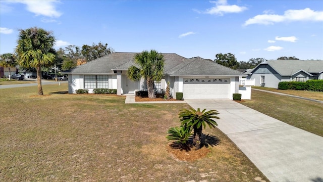 single story home with a garage and a front lawn