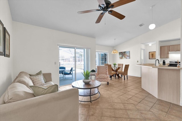 living room with sink, vaulted ceiling, ceiling fan, and light tile patterned flooring