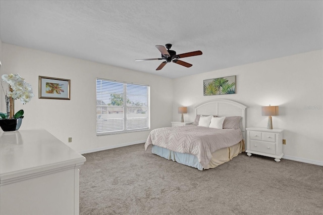 bedroom featuring a textured ceiling, ceiling fan, and carpet flooring