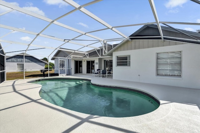 view of pool with a lanai and a patio