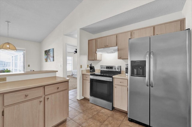 kitchen featuring light brown cabinetry, lofted ceiling, hanging light fixtures, light tile patterned floors, and stainless steel appliances