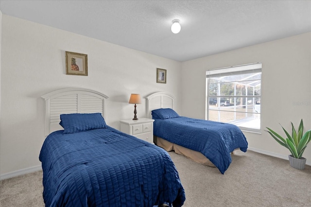 carpeted bedroom with a textured ceiling