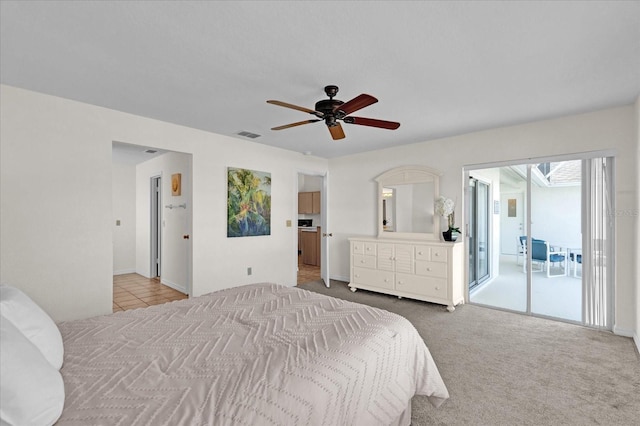 bedroom featuring ceiling fan, access to exterior, and light carpet